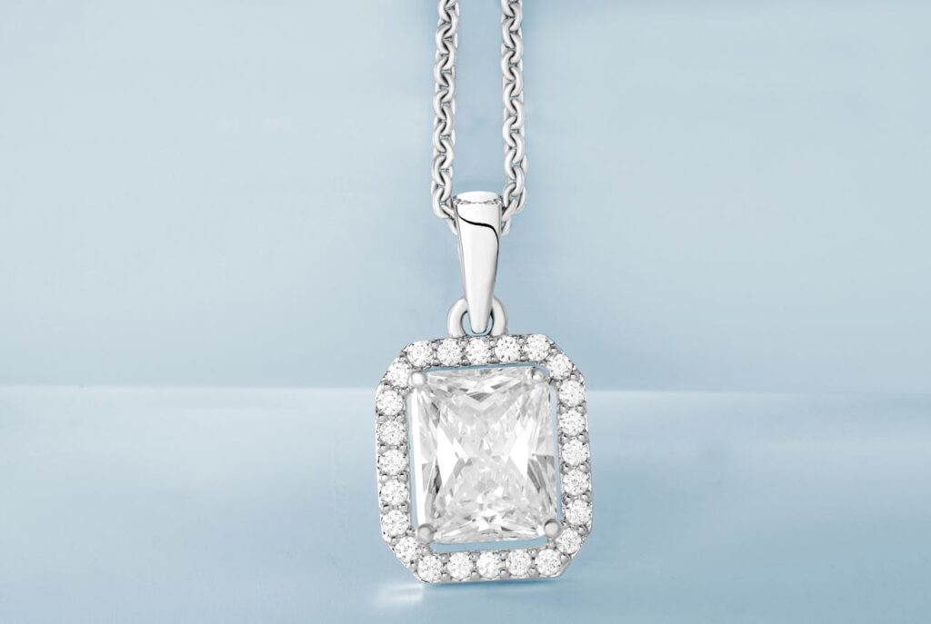pexels-photo-5370650 Silver Pendant with Diamonds in Close Up Photography