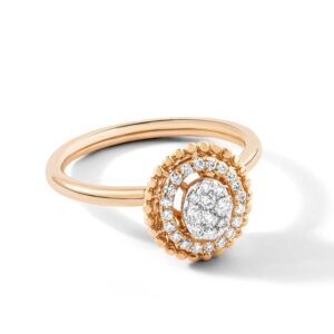 Close-Up Shot of Gold and Silver Diamond Ring on white Surface